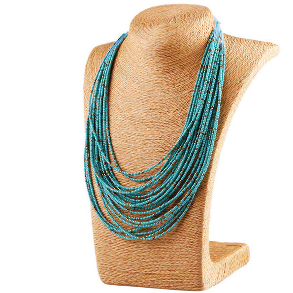 Retro Personality water drop multi-layer rice bead necklace.